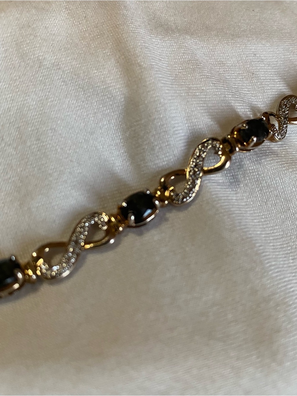 Gold Bracelet with Black Stones and Crystal Accents